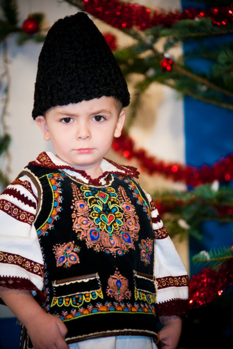 Baby Boy Against Christmas Tree