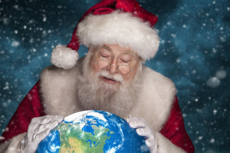 Real Santa Claus looking at Globe